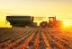 Tractor with the grain cart. Agriculture industry. Harvest.